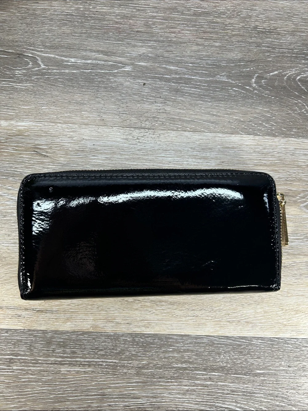 2828 Michael Kors Black Patent Leather Zip Wallet with Gold Plaque